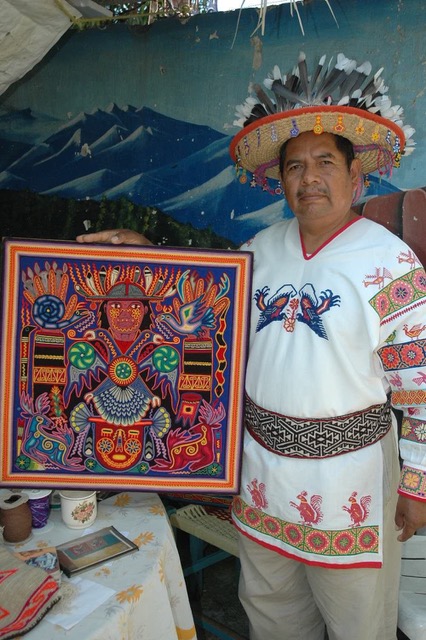 Eliseo Castro Villa Huichol artist with his yarn painting