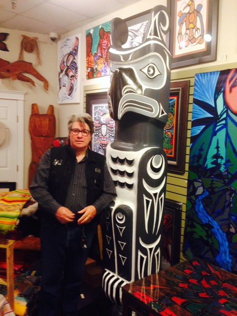 Wade Baker Squamish / Kwak'waka'wakw artist beside his pole