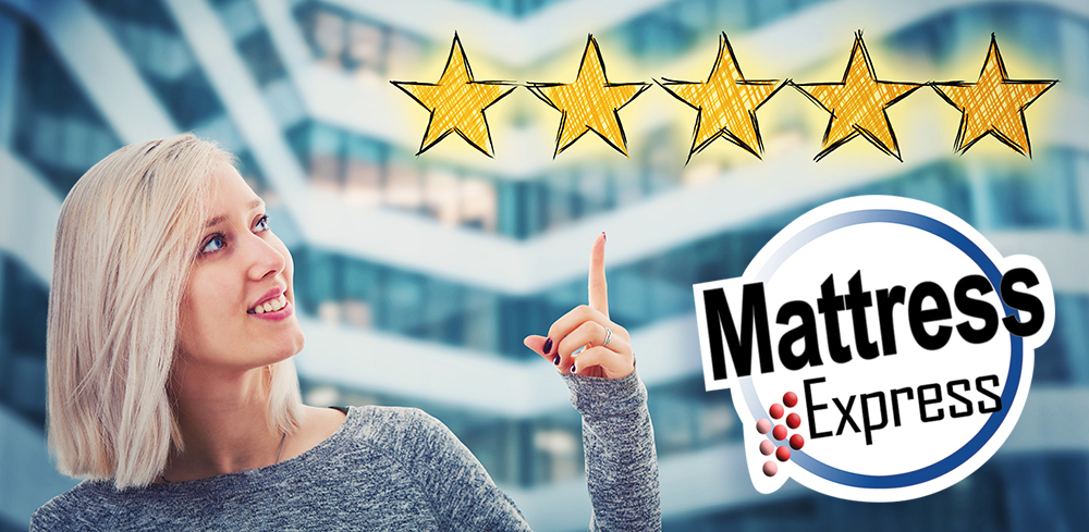 Female customer with blond hair giving mattress express a five star rating