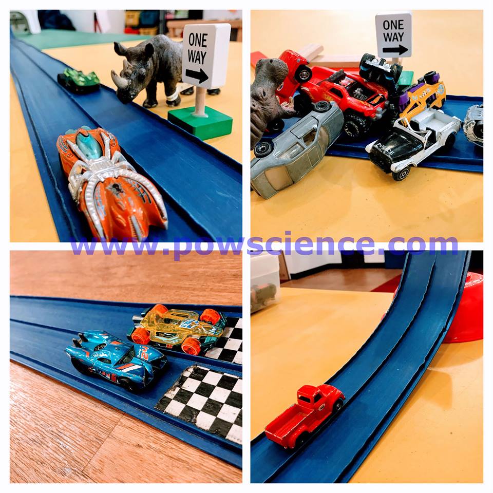 Hot Wheels cars and track.