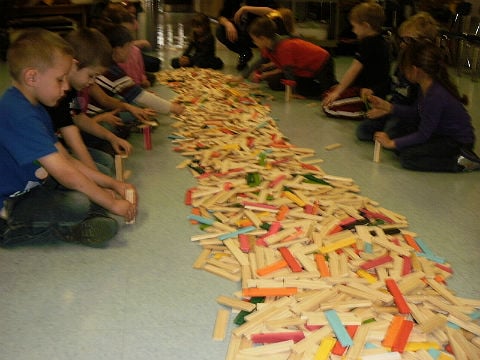 School children building with blocks