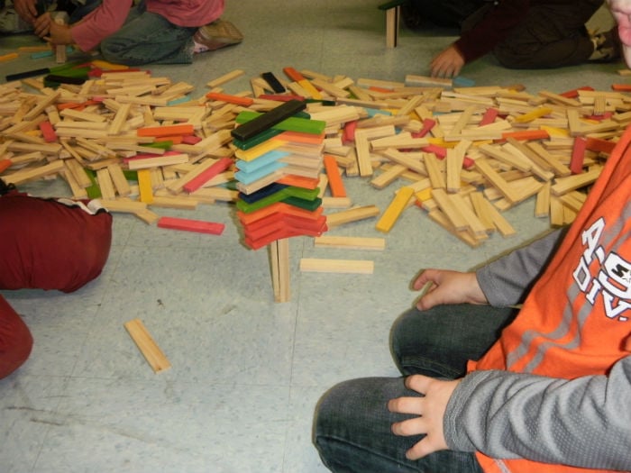 School children building with blocks