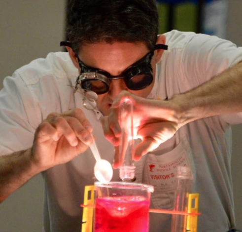 An instructor conducting a science experiment.